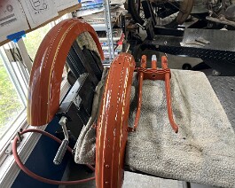 Front and rear fenders and front forks painted and pinstriped.